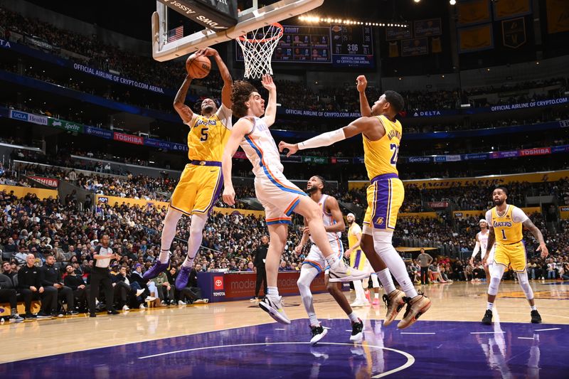 LOS ANGELES, CA - MARCH 4: Cam Reddish #5 of the Los Angeles Lakers rebounds the ball during the game against the Oklahoma City Thunder on March 4, 2024 at Crypto.Com Arena in Los Angeles, California. NOTE TO USER: User expressly acknowledges and agrees that, by downloading and/or using this Photograph, user is consenting to the terms and conditions of the Getty Images License Agreement. Mandatory Copyright Notice: Copyright 2024 NBAE (Photo by Andrew D. Bernstein/NBAE via Getty Images)