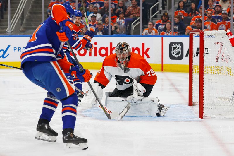 Jan 2, 2024; Edmonton, Alberta, CAN; Philadelphia Flyers goaltender Carter Hart (79) makes a save on Edmonton Oilers forward Ryan McLeod (71) during the first period at Rogers Place. Mandatory Credit: Perry Nelson-USA TODAY Sports