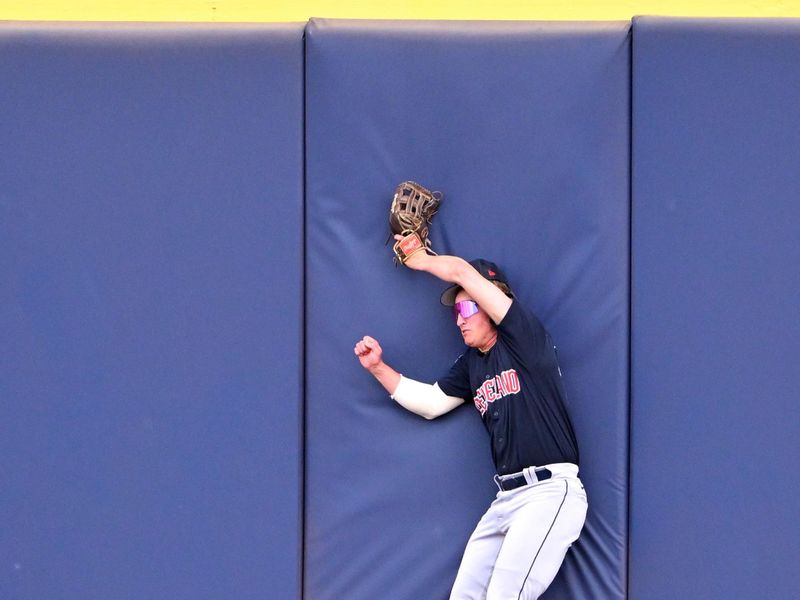 Feb 28, 2023; Peoria, Arizona, USA; Cleveland Guardians center fielder Petey Halpin (16) hits the wall in the second inning of a spring training game against the Seattle Mariners at the Peoria Sports Complex. Mandatory Credit: Jayne Kamin-Oncea-USA TODAY Sports