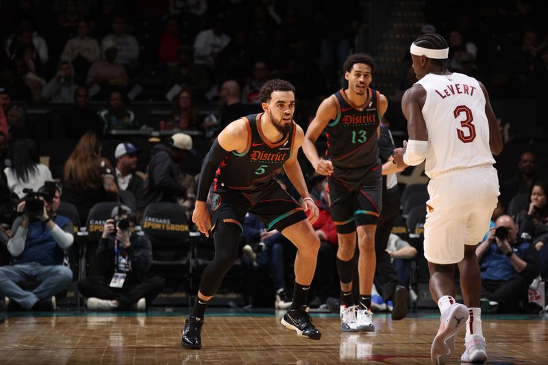 WASHINGTON, DC -? FEBRUARY 25: Tyus Jones #5 of the Washington Wizards plays defense during the game against the Cleveland Cavaliers on February 25, 2024 at Capital One Arena in Washington, DC. NOTE TO USER: User expressly acknowledges and agrees that, by downloading and or using this Photograph, user is consenting to the terms and conditions of the Getty Images License Agreement. Mandatory Copyright Notice: Copyright 2024 NBAE (Photo by Stephen Gosling/NBAE via Getty Images)