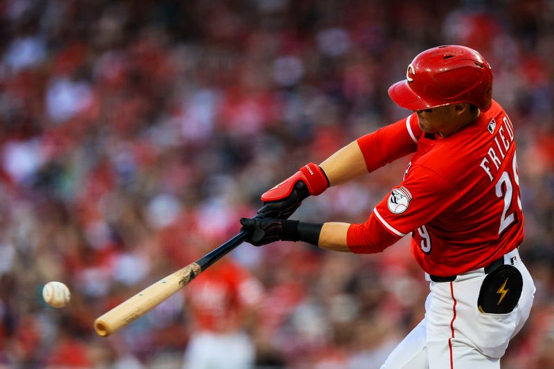 May 17, 2025; Cincinnati, Ohio, USA; Cincinnati Reds outfielder TJ Friedl (29) hits a double in the sixth inning against the Cleveland Guardians at Great American Ball Park. Mandatory Credit: Katie Stratman-Imagn Images