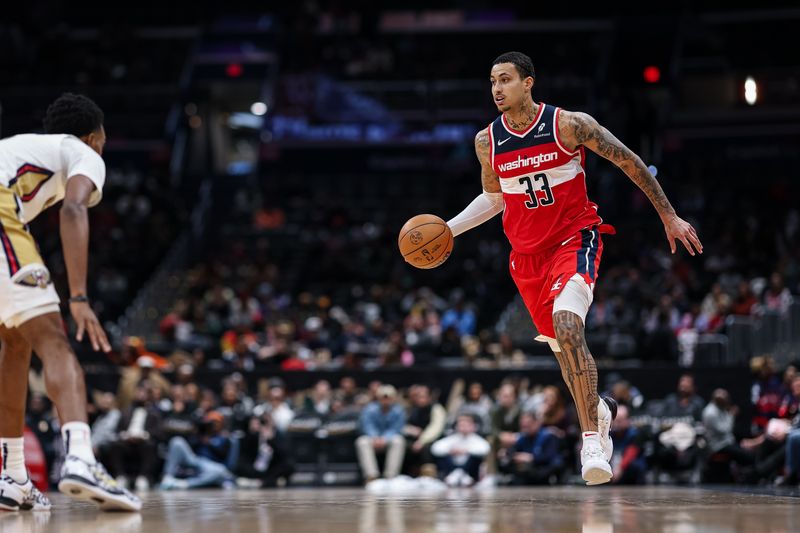 WASHINGTON, DC - JANUARY 05: Kyle Kuzma #33 of the Washington Wizards brings the ball up court against the New Orleans Pelicans during the second half at Capital One Arena on January 5, 2025 in Washington, DC. NOTE TO USER: User expressly acknowledges and agrees that, by downloading and or using this photograph, User is consenting to the terms and conditions of the Getty Images License Agreement. (Photo by Scott Taetsch/Getty Images)