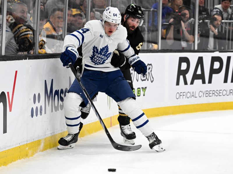 Apr 22, 2024; Boston, Massachusetts, USA; Toronto Maple Leafs center David Kampf (64) controls the puck against Boston Bruins left wing Pat Maroon (61) during the first period in game two of the first round of the 2024 Stanley Cup Playoffs at TD Garden. Mandatory Credit: Brian Fluharty-USA TODAY Sports