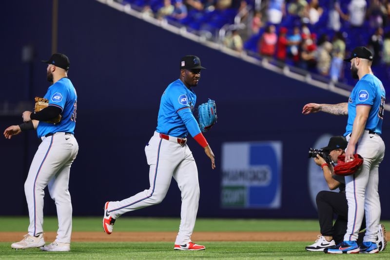 Jul 21, 2024; Miami, Florida, USA; Miami Marlins right fielder Jesus Sanchez (12) celebrates with teammates after the game against the New York Mets at loanDepot Park. Mandatory Credit: Sam Navarro-USA TODAY Sports