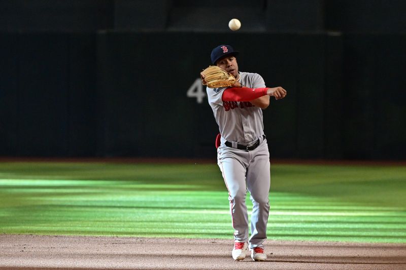 May 27, 2023; Phoenix, Arizona, USA;  Boston Red Sox second baseman Enmanuel Valdez (47) throws to first base against the Arizona Diamondbacks in the second inning at Chase Field. Mandatory Credit: Matt Kartozian-USA TODAY Sports