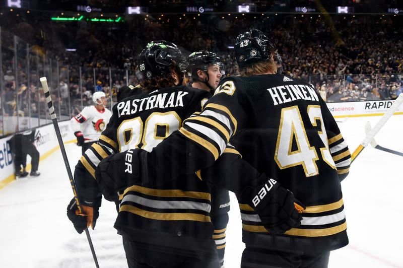 Mar 19, 2024; Boston, Massachusetts, USA;  Boston Bruins right wing David Pastrnak (88) is congratulated by his teammates after scoring a goal during the first period at TD Garden. Mandatory Credit: Bob DeChiara-USA TODAY Sports