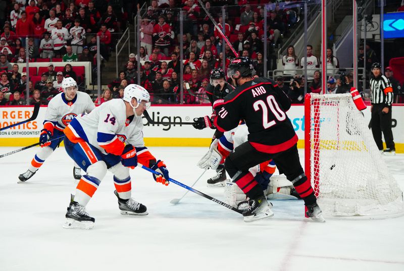 Apr 22, 2024; Raleigh, North Carolina, USA; Carolina Hurricanes center Sebastian Aho (20) scores a goal against the New York Islanders during the third period in game two of the first round of the 2024 Stanley Cup Playoffs at PNC Arena. Mandatory Credit: James Guillory-USA TODAY Sports