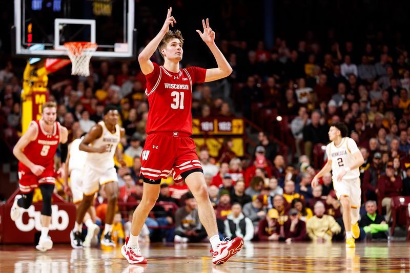 Jan 23, 2024; Minneapolis, Minnesota, USA; Wisconsin Badgers forward Nolan Winter (31) celebrates his shot against the Minnesota Golden Gophers during the first half at Williams Arena. Mandatory Credit: Matt Krohn-USA TODAY Sports