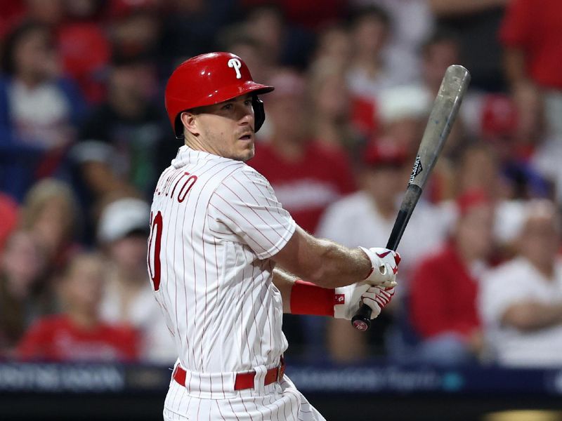 Oct 4, 2023; Philadelphia, Pennsylvania, USA; Philadelphia Phillies catcher J.T. Realmuto (10) hits a double against the Miami Marlins during the second inning for game two of the Wildcard series for the 2023 MLB playoffs at Citizens Bank Park. Mandatory Credit: Bill Streicher-USA TODAY Sports