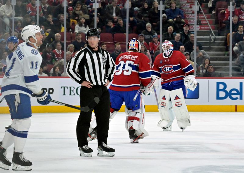 Nov 7, 2023; Montreal, Quebec, CAN; Montreal Canadiens goalie Sam Montembeault (35) replaces teammate goalie Jake Allen (34)  during the first period of the game against the Tampa Bay Lightning at the Bell Centre. Mandatory Credit: Eric Bolte-USA TODAY Sports