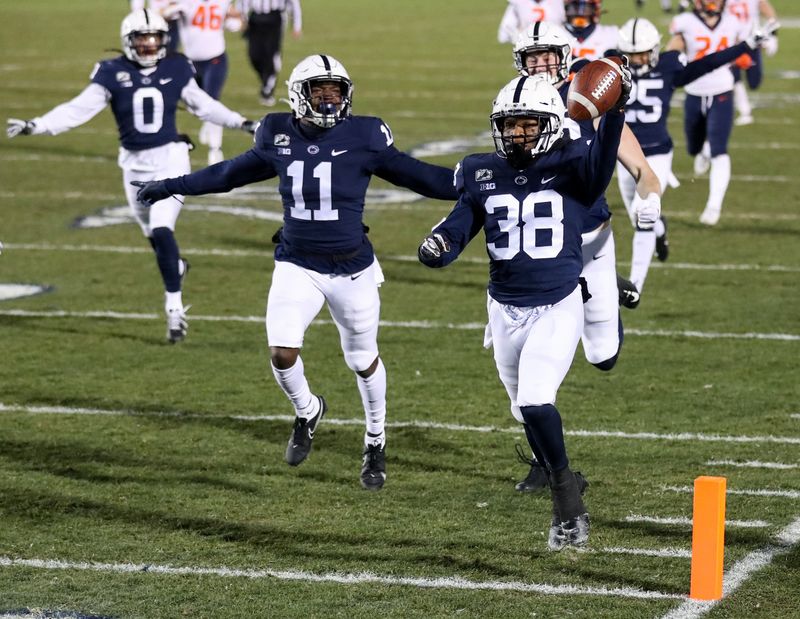 Dec 19, 2020; University Park, Pennsylvania, USA; Penn State Nittany Lions running back Tank Smith (38) reacts after scoring a touchdown on a punt return during the first quarter against the Illinois Fighting Illini at Beaver Stadium. Mandatory Credit: Matthew OHaren-USA TODAY Sports