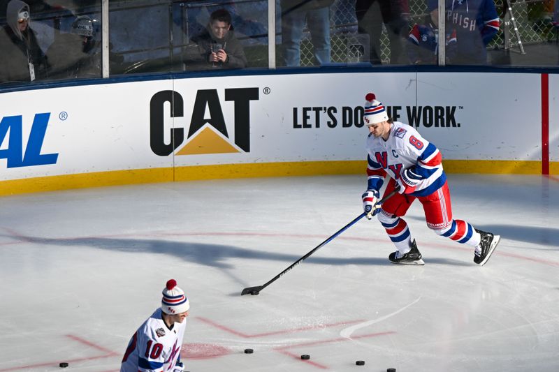 Feb 18, 2024; East Rutherford, New Jersey, USA;  New York Rangers defenseman Jacob Trouba (8) warms ups in the game between the New York Islanders and the New York Rangers during warmups in a Stadium Series ice hockey game at MetLife Stadium. Mandatory Credit: Dennis Schneidler-USA TODAY Sports