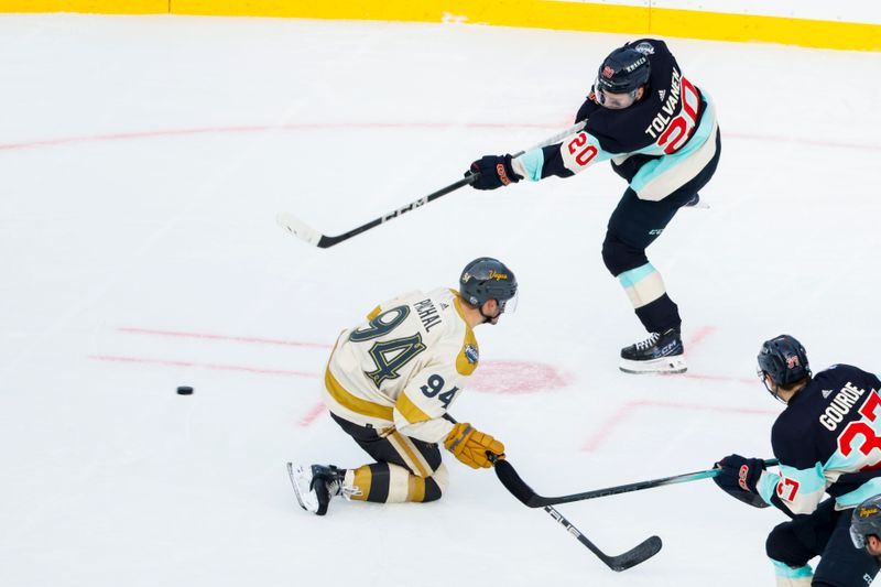 Jan 1, 2024; Seattle, Washington, USA; Seattle Kraken right wing Eeli Tolvanen (20) shoots the puck past Vegas Golden Knights defenseman Brayden Pachal (94) during the third period in the 2024 Winter Classic ice hockey game at T-Mobile Park. Mandatory Credit: Joe Nicholson-USA TODAY Sports