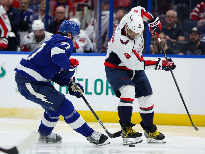 Feb 22, 2024; Tampa, Florida, USA;  Washington Capitals left wing Alex Ovechkin (8) controls the puck from Tampa Bay Lightning defenseman Victor Hedman (77) in the second period at Amalie Arena. Mandatory Credit: Nathan Ray Seebeck-USA TODAY Sports