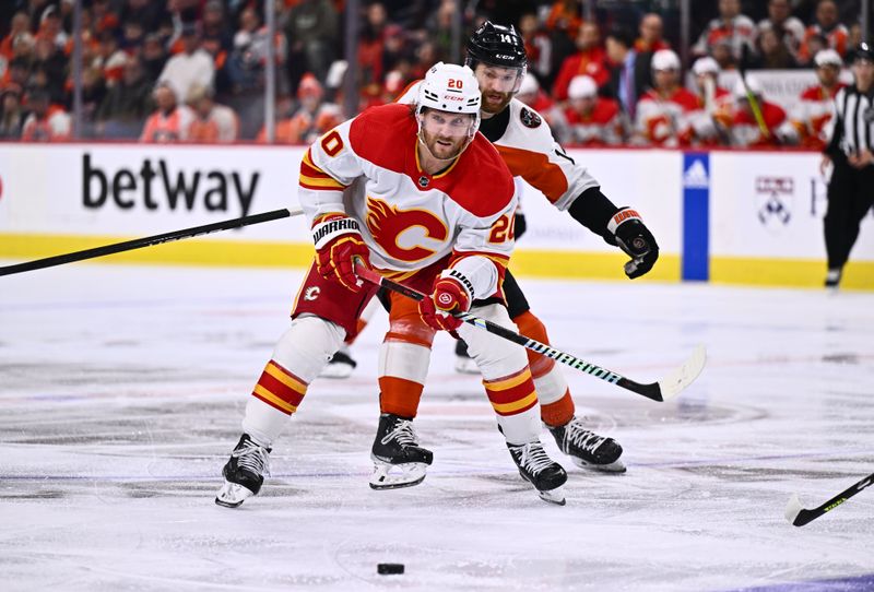 Jan 6, 2024; Philadelphia, Pennsylvania, USA; Calgary Flames center Blake Coleman (20) passes the puck against the Philadelphia Flyers in the third period at Wells Fargo Center. Mandatory Credit: Kyle Ross-USA TODAY Sports