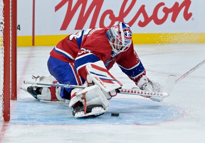 Oct 17, 2024; Montreal, Quebec, CAN; Montreal Canadiens goalie Sam Montembeault (35) covers up the puck during the third period of the game against the Los Angeles Kings at the Bell Centre. Mandatory Credit: Eric Bolte-Imagn Images