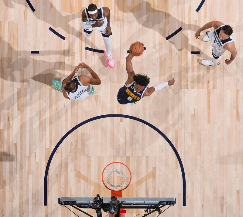 DENVER, CO - APRIL 10: Peyton Watson #8 of the Denver Nuggets dunks the ball during the game against the Minnesota Timberwolves  on April 10, 2024 at the Ball Arena in Denver, Colorado. NOTE TO USER: User expressly acknowledges and agrees that, by downloading and/or using this Photograph, user is consenting to the terms and conditions of the Getty Images License Agreement. Mandatory Copyright Notice: Copyright 2024 NBAE (Photo by Bart Young/NBAE via Getty Images)