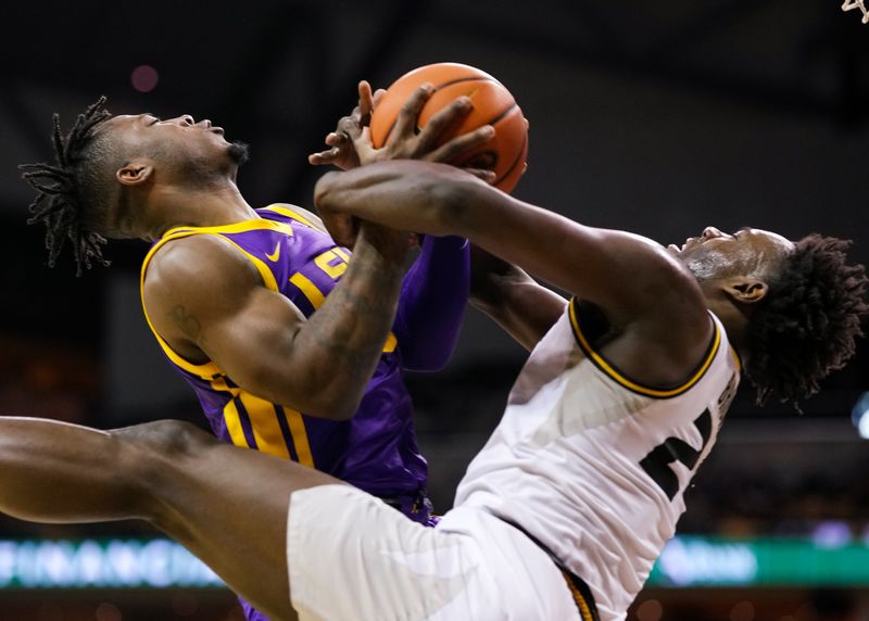 Feb 1, 2023; Columbia, Missouri, USA; LSU Tigers guard Trae Hannibal (0) and Missouri Tigers guard Kobe Brown (24) fight for the ball during the second half at Mizzou Arena. Mandatory Credit: Jay Biggerstaff-USA TODAY Sports