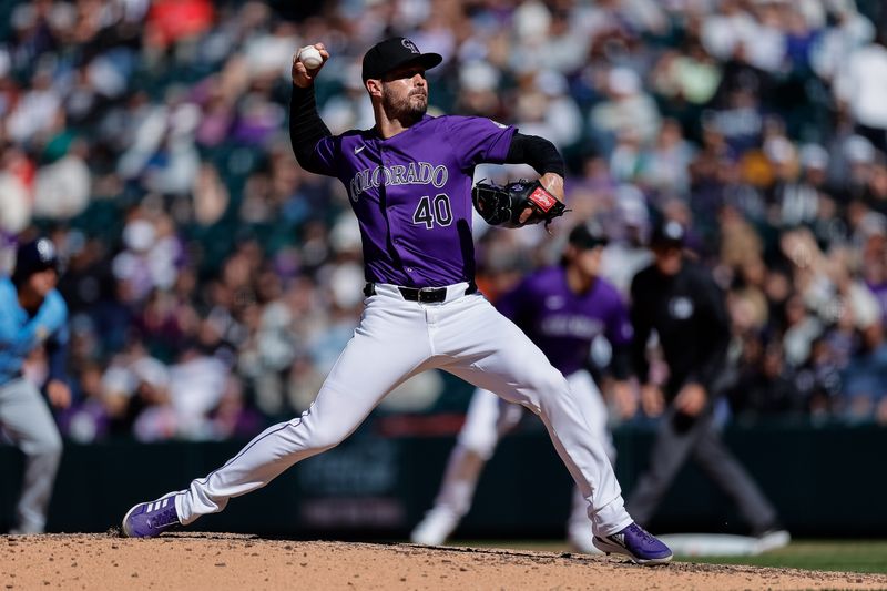 Apr 7, 2024; Denver, Colorado, USA; Colorado Rockies relief pitcher Tyler Kinley (40) pitches in the eighth inning against the Tampa Bay Rays at Coors Field. Mandatory Credit: Isaiah J. Downing-USA TODAY Sports