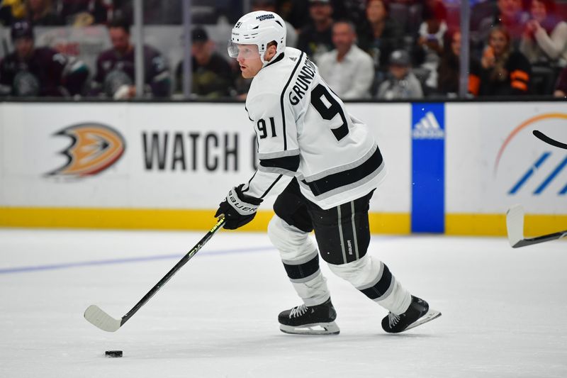 Nov 24, 2023; Anaheim, California, USA; Los Angeles Kings right wing Carl Grundstrom (91) moves the puck against the Anaheim Ducks during the second period at Honda Center. Mandatory Credit: Gary A. Vasquez-USA TODAY Sports