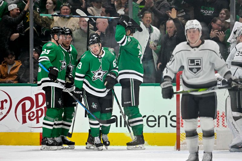 Jan 16, 2024; Dallas, Texas, USA; Dallas Stars defenseman Esa Lindell (23) and right wing Evgenii Dadonov (63) and defenseman Jani Hakanpaa (2) celebrates a goal scored by Dadonov against the Los Angeles Kings during the first period at the American Airlines Center. Mandatory Credit: Jerome Miron-USA TODAY Sports