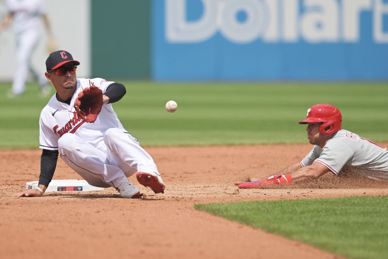 Jul 23, 2023; Cleveland, Ohio, USA; Philadelphia Phillies catcher J.T. Realmuto (10) steals second as Cleveland Guardians second baseman Andres Gimenez (0) waits for the throw during the sixth inning at Progressive Field. Mandatory Credit: Ken Blaze-USA TODAY Sports