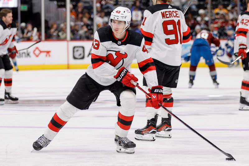 Nov 7, 2023; Denver, Colorado, USA; New Jersey Devils defenseman Luke Hughes (43) warms up before the game against the Colorado Avalanche at Ball Arena. Mandatory Credit: Isaiah J. Downing-USA TODAY Sports