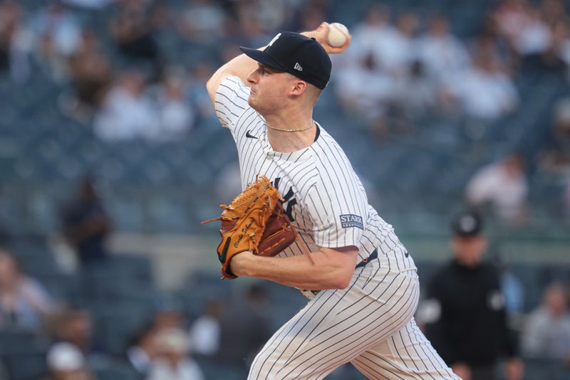 May 21, 2024; Bronx, New York, USA; New York Yankees starting pitcher Clarke Schmidt (36) delivers a pitch during the first inning against the Seattle Mariners at Yankee Stadium. Mandatory Credit: Vincent Carchietta-USA TODAY Sports