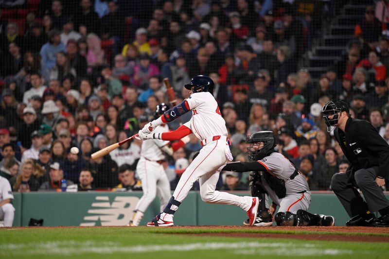 May 1, 2024; Boston, Massachusetts, USA; Boston Red Sox shortstop Ceddanne Rafaela (43) hits a single against the San Francisco Giants during the third inning at Fenway Park. Mandatory Credit: Eric Canha-USA TODAY Sports