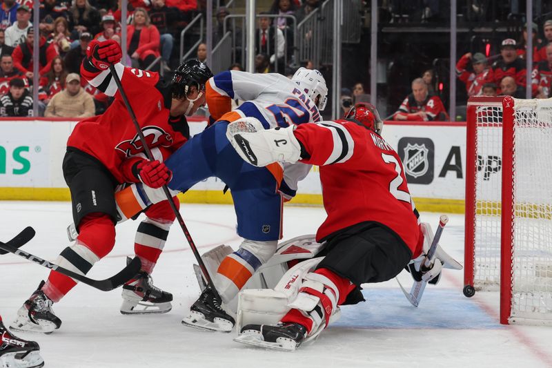 Nov 10, 2025; Newark, New Jersey, USA; New York Islanders center Kyle Palmieri (21) scores a goal on New Jersey Devils goaltender Jacob Markstrom (25) during the third period at Prudential Center. Mandatory Credit: Ed Mulholland-Imagn Images