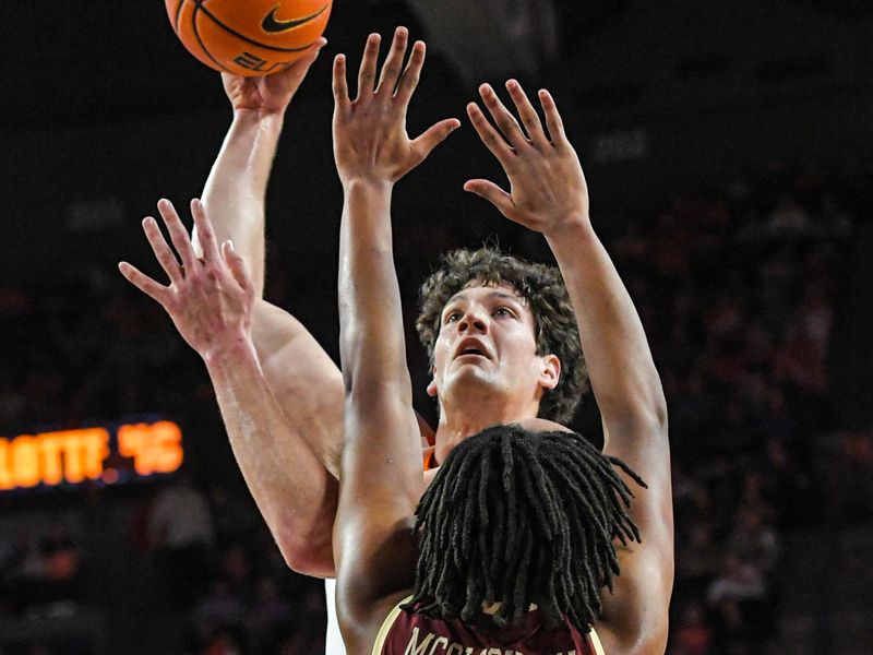 Jan 13, 2024; Clemson, South Carolina, USA; Clemson Tigers forward PJ Hall (24) shoots the ball against Boston College Eagles forward Devin McGlockton (21) during the first half at Littlejohn Coliseum. Mandatory Credit: Ken Ruinard-USA TODAY Sports