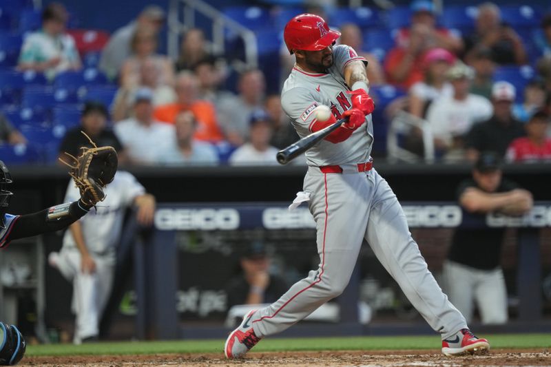 Apr 2, 2024; Miami, Florida, USA; Los Angeles Angels right fielder Aaron Hicks (12) hits a solo home run against the Miami Marlins in the fourth inning at loanDepot Park. Mandatory Credit: Jim Rassol-USA TODAY Sports