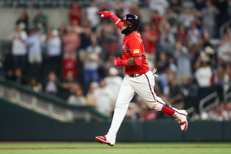 Apr 26, 2024; Atlanta, Georgia, USA; Atlanta Braves shortstop Orlando Arcia (11) celebrates after a home run against the Cleveland Guardians in the eighth inning at Truist Park. Mandatory Credit: Brett Davis-USA TODAY Sports
