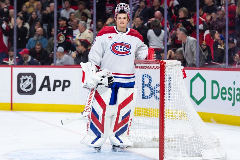 Apr 11, 2025; Ottawa, Ontario, CAN; Montreal Canadiens goalie Sam Montembeault (35) reacts to a goal scored by the Ottawa Senators  in the first period at the Canadian Tire Centre. Mandatory Credit: Marc DesRosiers-Imagn Images