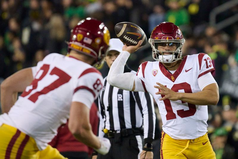 Nov 11, 2023; Eugene, Oregon, USA; USC Trojans quarterback Caleb Williams (13) warms up before a game against the Oregon Ducks punter at Autzen Stadium. Mandatory Credit: Troy Wayrynen-USA TODAY Sports