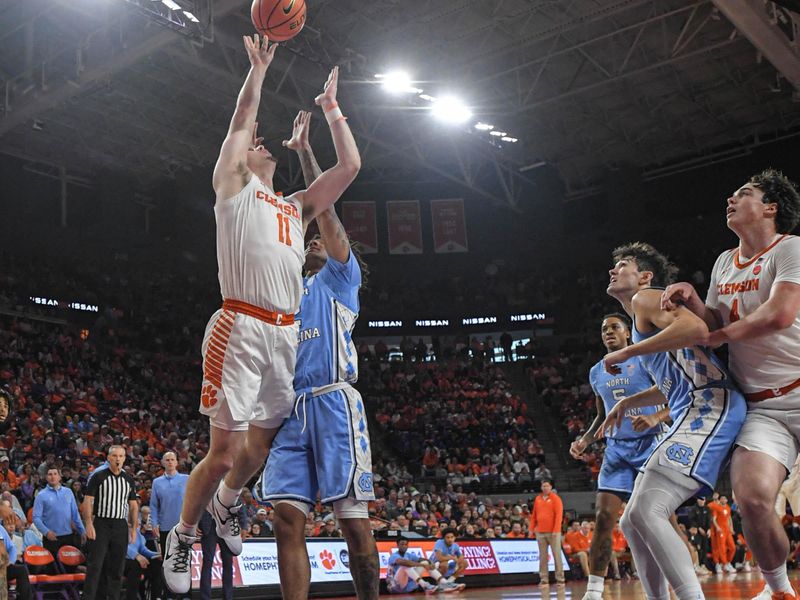 Jan 6, 2024; Clemson, South Carolina, USA; Clemson graduate Joseph Girard III shoots against North Carolina during the first half  at Littlejohn Coliseum. Mandatory Credit: Ken Ruinard-USA TODAY Sports