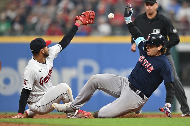 Jun 6, 2023; Cleveland, Ohio, USA; Boston Red Sox first baseman Triston Casas (36) slides into second with a double as Cleveland Guardians shortstop Gabriel Arias (13) can not make the catch of the relay throw during the ninth inning at Progressive Field. Mandatory Credit: Ken Blaze-USA TODAY Sports