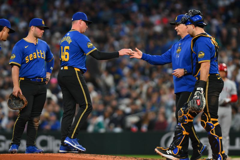 May 31, 2024; Seattle, Washington, USA; Seattle Mariners manager Scott Servais (9) pulls relief pitcher Trent Thornton (46) from the game during the seventh inning against the Los Angeles Angels at T-Mobile Park. Mandatory Credit: Steven Bisig-USA TODAY Sports