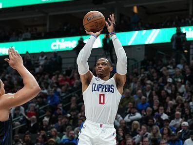 DALLAS, TX - DECEMBER 20: Russell Westbrook #0 of the LA Clippers shoots a three point basket during the game against the Dallas Mavericks on December 20, 2023 at the American Airlines Center in Dallas, Texas. NOTE TO USER: User expressly acknowledges and agrees that, by downloading and or using this photograph, User is consenting to the terms and conditions of the Getty Images License Agreement. Mandatory Copyright Notice: Copyright 2023 NBAE (Photo by Glenn James/NBAE via Getty Images)