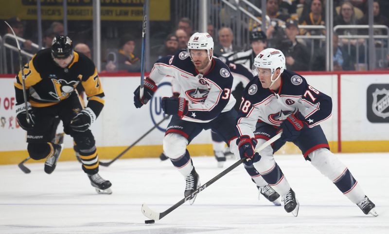 Mar 21, 2025; Pittsburgh, Pennsylvania, USA;  Columbus Blue Jackets defenseman Damon Severson (78) skates with the puck against the Pittsburgh Penguins during the second period at PPG Paints Arena. Mandatory Credit: Charles LeClaire-Imagn Images
