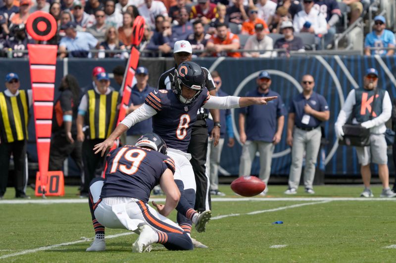 Chicago Bears place kicker Cairo Santos kicks a field goal off the hold of Tory Taylor during the first half of an NFL football game against the Tennessee Titans on Sunday, Sept. 8, 2024, in Chicago. (AP Photo/Nam Y. Huh)