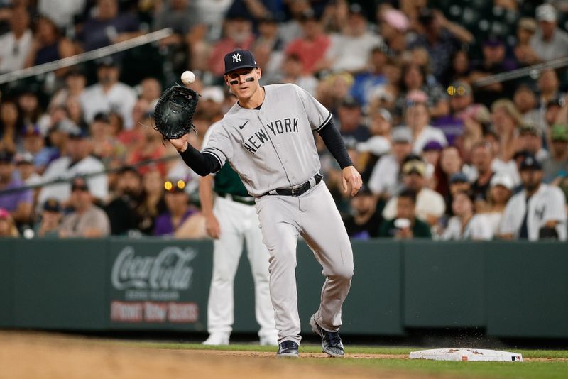 Jul 15, 2023; Denver, Colorado, USA; New York Yankees first baseman Anthony Rizzo (48) fields a throw at first for an out in the ninth inning against the Colorado Rockies at Coors Field. Mandatory Credit: Isaiah J. Downing-USA TODAY Sports