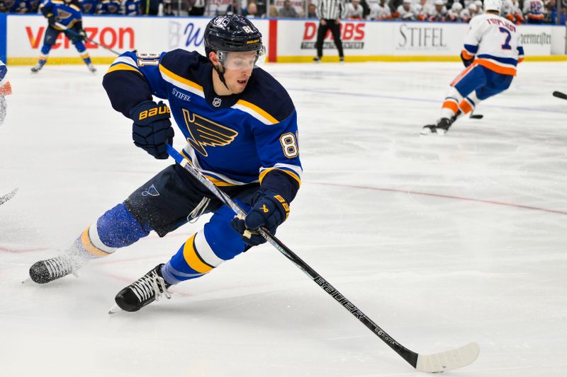 Oct 17, 2024; St. Louis, Missouri, USA;  St. Louis Blues center Dylan Holloway (81) controls the puck against the New York Islanders during the first period at Enterprise Center. Mandatory Credit: Jeff Curry-Imagn Images