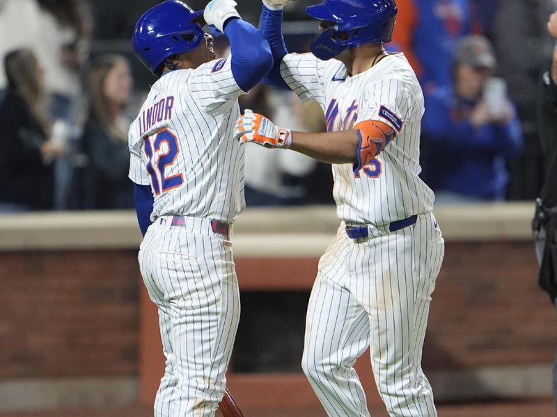 Apr 30, 2025; New York City, New York, USA; New York Mets shortstop Francisco Lindor (12) congratulates center fielder Tyrone Taylor (15) for hitting a home run against the Arizona Diamondbacks during the ninth inning at Citi Field. Mandatory Credit: Gregory Fisher-Imagn Images