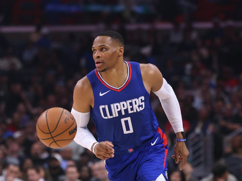 LOS ANGELES, CALIFORNIA - DECEMBER 12: Russell Westbrook #0 of the LA Clippers brings up the ball during a 119-99 Clippers win over the Sacramento Kings at Crypto.com Arena on December 12, 2023 in Los Angeles, California.  NOTE TO USER: User expressly acknowledges and agrees that, by downloading and or using this photograph, User is consenting to the terms and conditions of the Getty Images License Agreement. (Photo by Harry How/Getty Images)