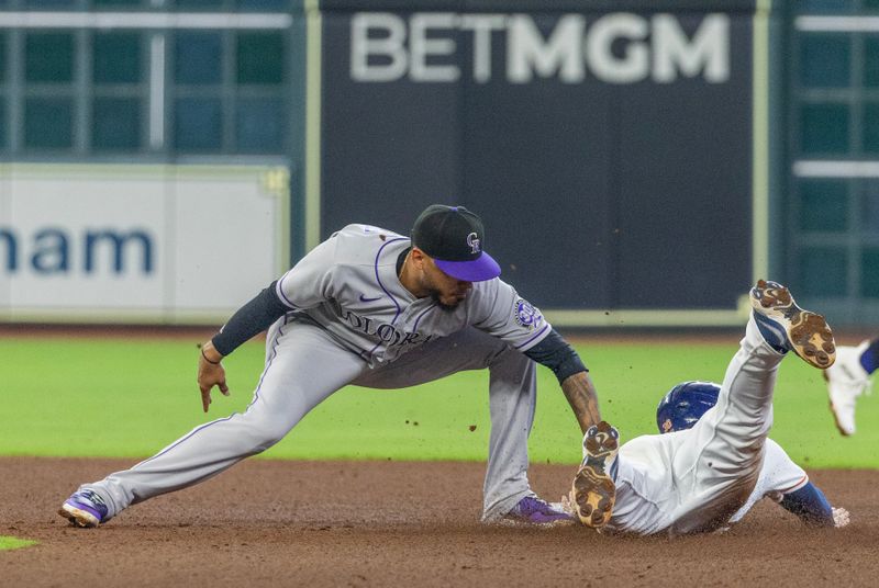 Jul 5, 2023; Houston, Texas, USA; Houston Astros right fielder Kyle Tucker (30) is tagged out while trying to steal second base against Colorado Rockies second baseman Harold Castro (30) in the fourth inning at Minute Maid Park. Mandatory Credit: Thomas Shea-USA TODAY Sports