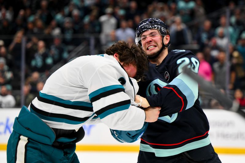 Jan 30, 2025; Seattle, Washington, USA; Seattle Kraken defenseman Vince Dunn (29) fights with San Jose Sharks defenseman Henry Thrun (3) during the second period at Climate Pledge Arena. Mandatory Credit: Steven Bisig-Imagn Images