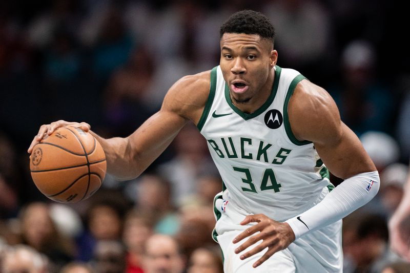 CHARLOTTE, NORTH CAROLINA - NOVEMBER 17: Giannis Antetokounmpo #34 of the Milwaukee Bucks brings the ball up court in the first quarter during an NBA In-Season Tournament game against the Charlotte Hornets at Spectrum Center on November 17, 2023 in Charlotte, North Carolina. NOTE TO USER: User expressly acknowledges and agrees that, by downloading and or using this photograph, User is consenting to the terms and conditions of the Getty Images License Agreement. (Photo by Jacob Kupferman/Getty Images)