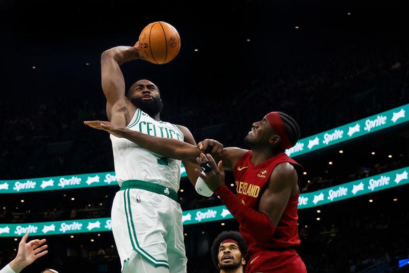 BOSTON, MA - DECEMBER 14: Jaylen Brown #7 of the Boston Celtics goes to the basket against Caris LeVert #3 of the Cleveland Cavaliers during the second half at TD Garden on December 14, 2023 in Boston, Massachusetts. NOTE TO USER: User expressly acknowledges and agrees that, by downloading and/or using this Photograph, user is consenting to the terms and conditions of the Getty Images License Agreement. (Photo By Winslow Townson/Getty Images)