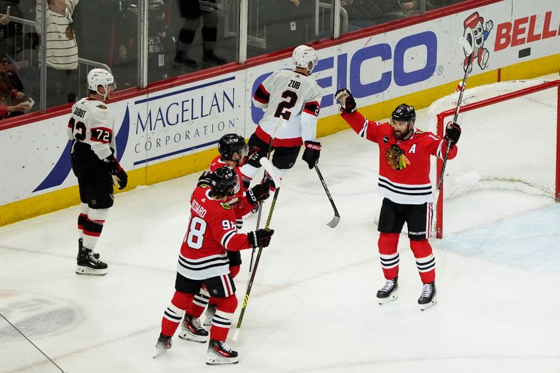 Feb 17, 2024; Chicago, Illinois, USA; Chicago Blackhawks left wing Nick Foligno (17) celebrates his goal with Chicago Blackhawks center Connor Bedard (98) against the Ottawa Senators during the first period at United Center. Mandatory Credit: David Banks-USA TODAY Sports